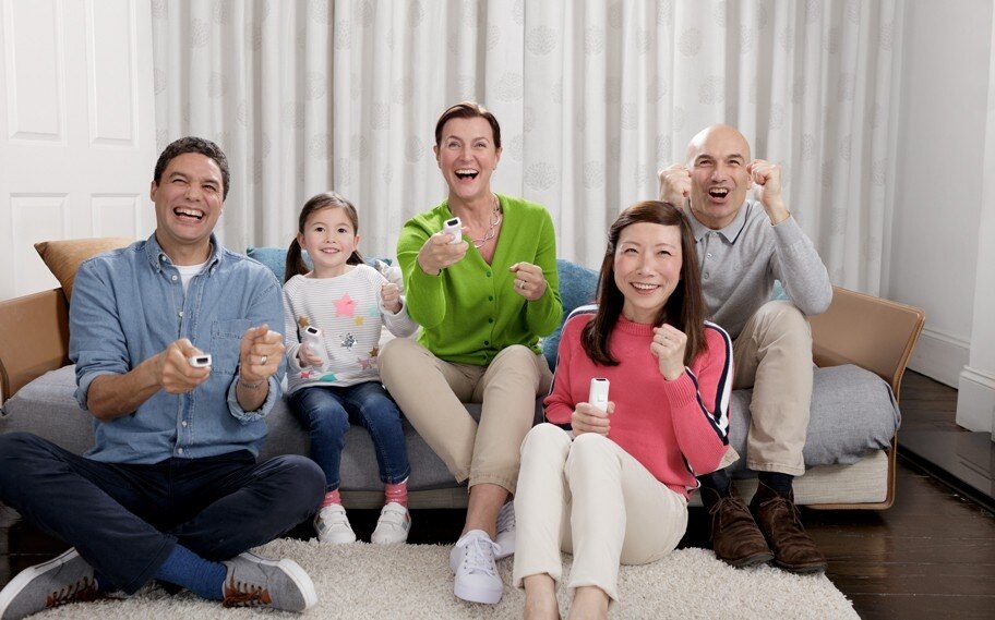 Phonak_Well_Hearing_is_Well_Being_happy_family_playing_video_game.jpg